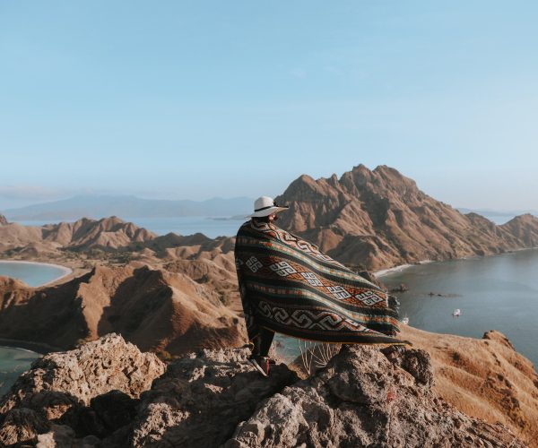 person standing alone in a hilly area